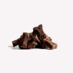 Beco Snack Natural Dog Choc snack para perros en envase rosado, galleta tipo hueso con fórmula relajante y horneado suave