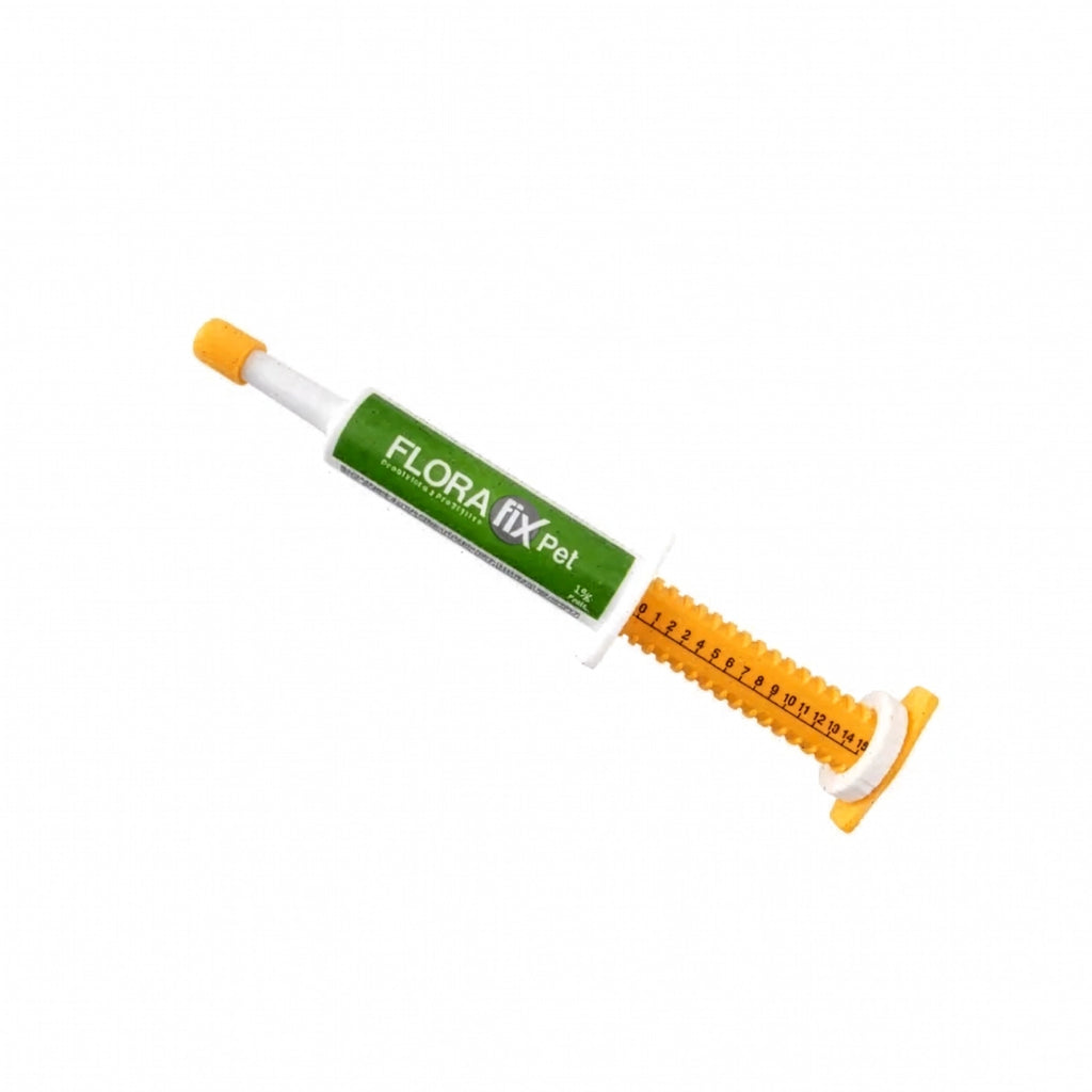 Florafix Pet en jeringa dosificadora verde y amarilla para apoyo digestivo y equilibrio intestinal en mascotas.