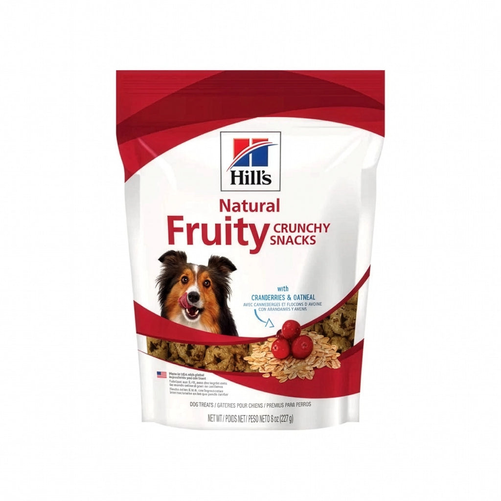 Hill's Snacks de Arándanos y Avena para Perros en bolsa blanca con imagen de un perro, arándanos, avena y premios crujientes.