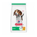 Hill's Healthy Development para Cachorros con receta de pollo y arroz integral, alimento seco para cachorros en envase con un perro Beagle.
