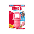 Juguete KONG Puppy Binkie rosado con forma de chupete, fabricado en goma suave para cachorros en etapa de dentición.