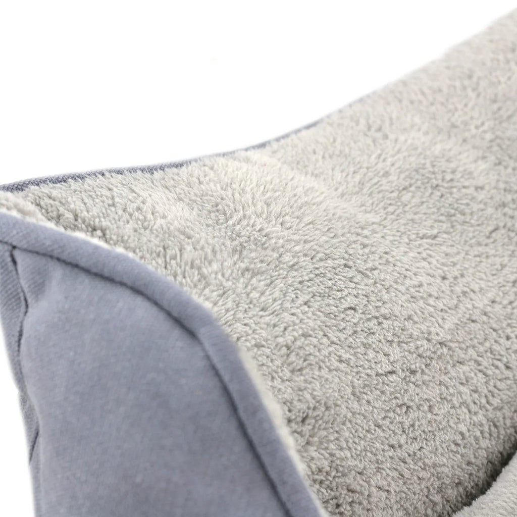 Cama "Bolster" Tall Tails color Charcoal para perros, cama acolchada gris con bordes altos y centro suave afelpado